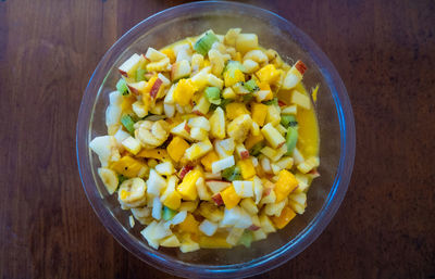 High angle view of chopped vegetables in bowl on table