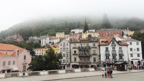 Buildings in city against sky