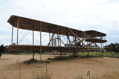 Built structure on field against sky