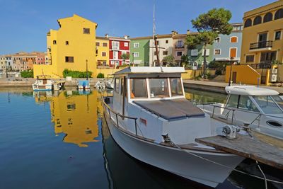 Close-up of boats moored in water