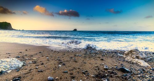 Scenic view of sea against sky during sunset