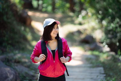 Portrait of woman standing outdoors