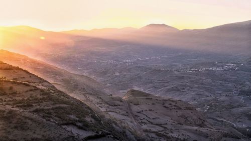 Scenic view of landscape against sky during sunset