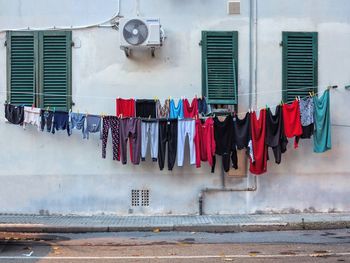 Clothes drying against wall