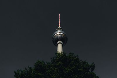 Low angle view of fernsehturm against sky at night
