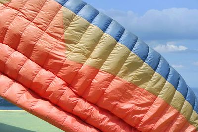Parachute against sky on sunny day