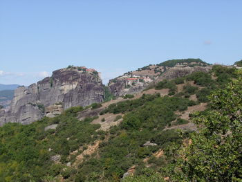 Scenic view of rocky mountains against clear sky