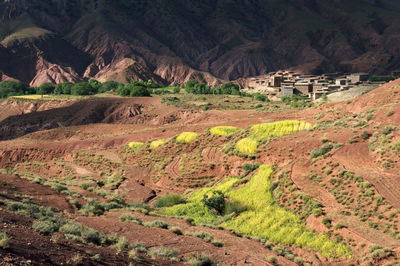 View of landscape with mountain range in background