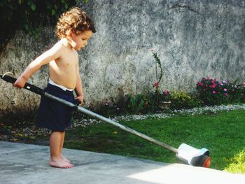 Boy playing in yard