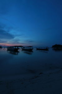 Scenic view of sea against sky at dusk