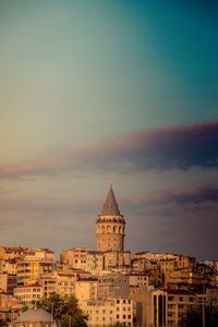 View of galata tower in town during sunset