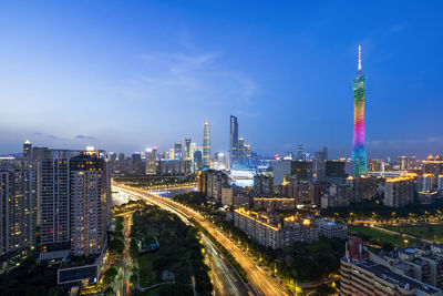 Aerial view of city lit up at night