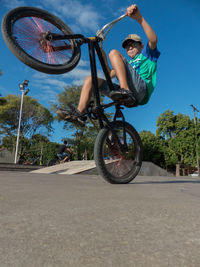 Outdoor portrait of boy riding bicycle