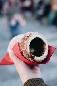 Close-up of hand holding ice cream