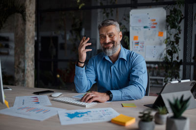 Portrait of businessman working at office