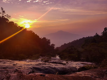 Scenic view of mountains against sky during sunset