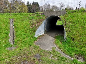 Bridge over canal amidst field