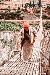 Portrait of man working with rope