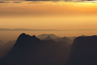 Layer of mountains with misty in morning