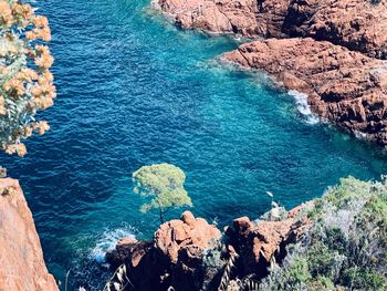 High angle view of rocks by sea