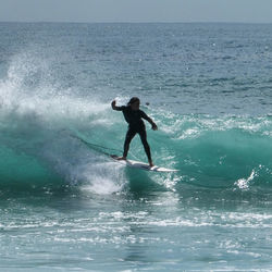 Full length of man on sea against sky