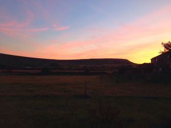 Scenic view of landscape at sunset