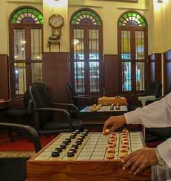 Man sitting on table in building