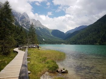 Scenic view of lake and mountains against sky