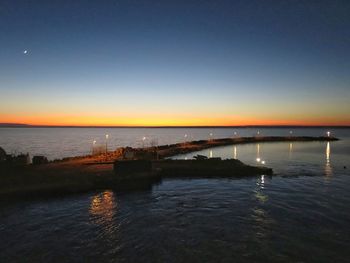 Scenic view of sea against sky at sunset