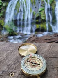 Close-up of navigational compass on table