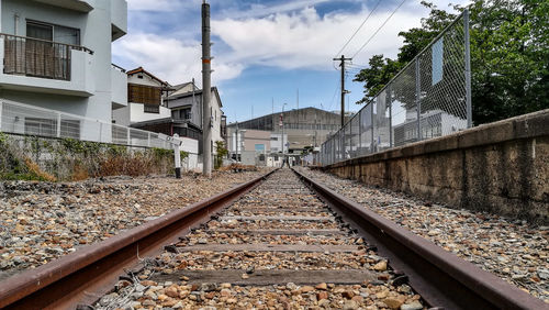 Surface level of railroad tracks against buildings