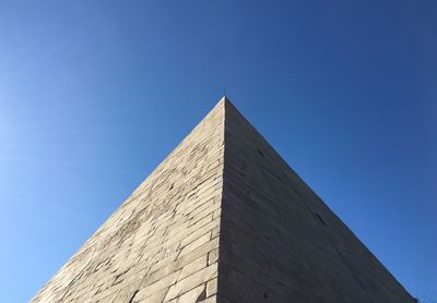 Low angle view of historical building against blue sky