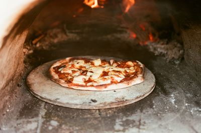 Making a pizza in hand made pizza owen