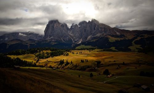 Scenic view of mountains against cloudy sky