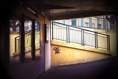 Railing reflecting on glass at railroad station