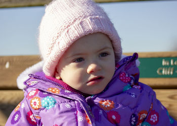 Close-up of cute baby girl wearing warm clothing