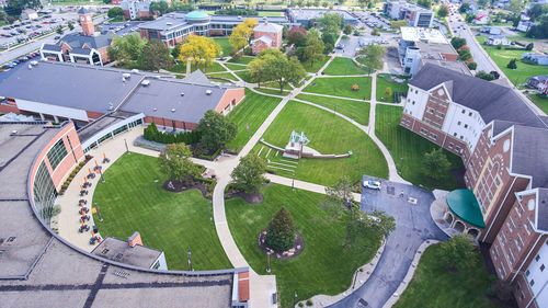 High angle view of swimming pool by buildings in city