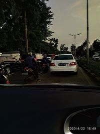 Cars on street seen through windshield