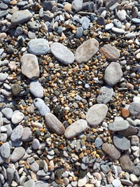 High angle view of stones on pebbles