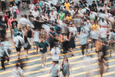 Group of people walking on city street