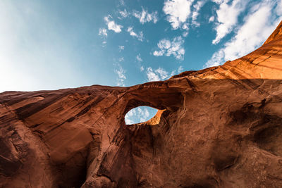 Low angle view of rock formations against sky