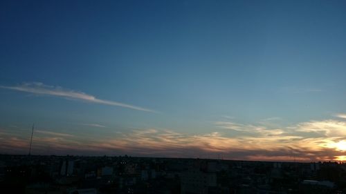 Cityscape against sky during sunset