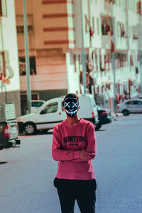 Man standing on street in city