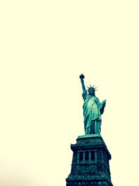 Low angle view of statue of liberty against clear sky