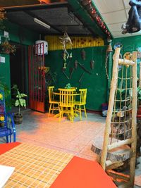 Empty chairs and tables in restaurant