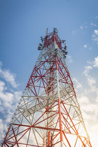 Low angle view of communications tower against sky