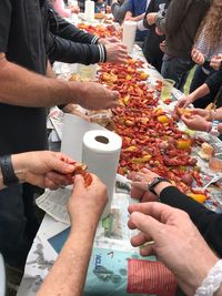 High angle view of people holding food at market