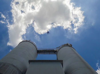 Low angle view of bird flying against sky