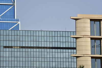 Low angle view of building against clear blue sky