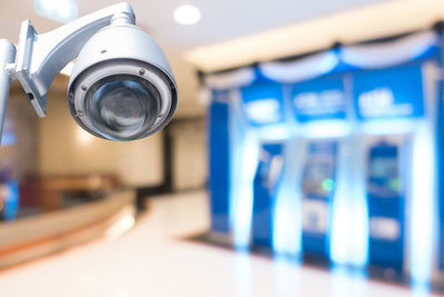 Close-up of security camera at shopping mall